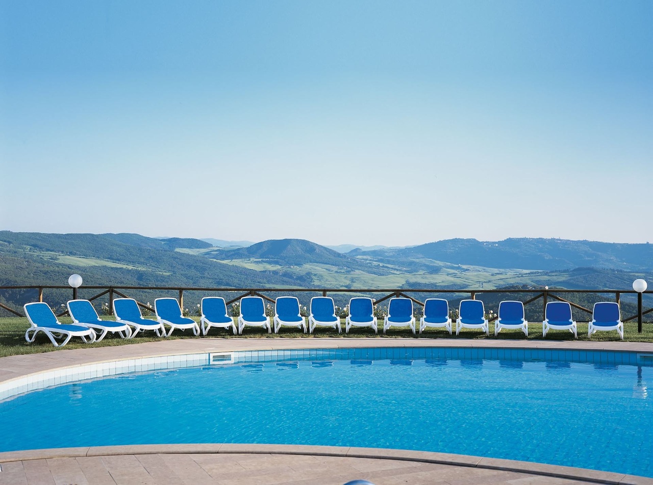 Commercial poolside sun loungers overlooking the landscape